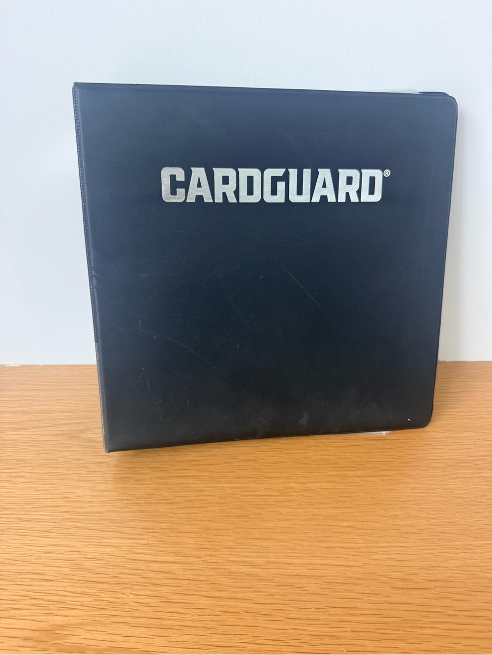 CardGuard Black Card Binder with over 100 protective sheets.